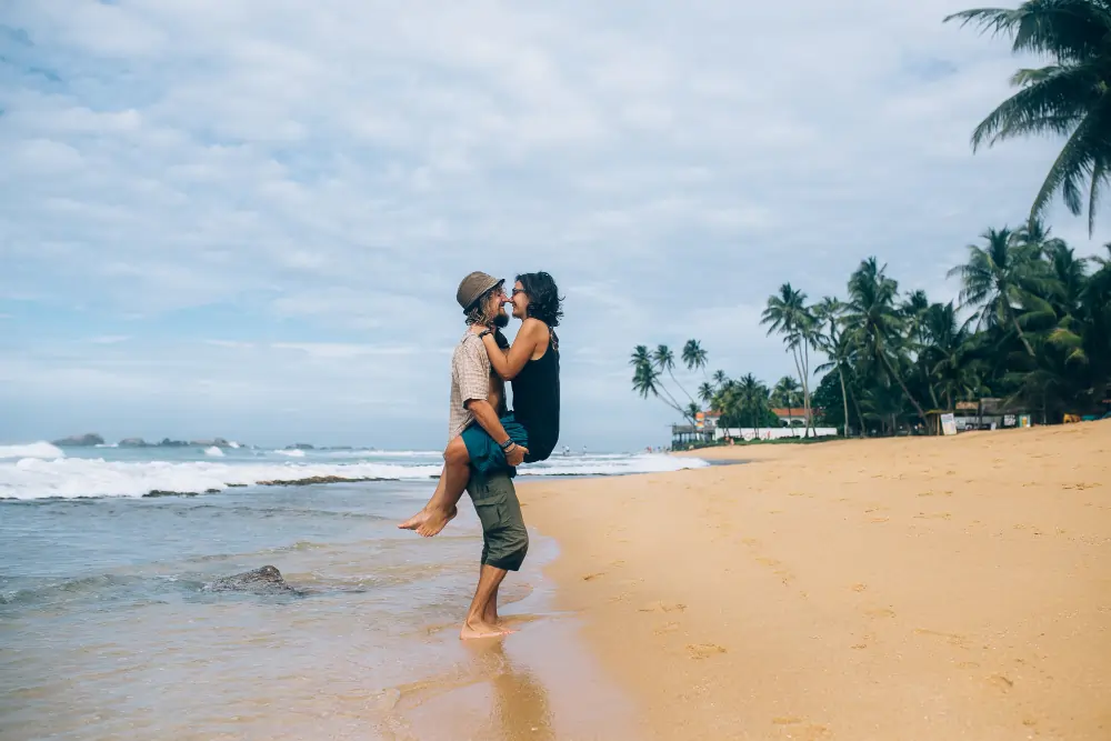 Couple enjoying a beach holiday in Sri Lanka, arranged by Sesatha Travel, one of the best travel agents in Brisbane