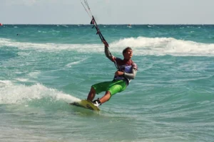 Kitesurfer mastering the waves in Kalpitiya, a popular destination for Sri Lanka surfing tours