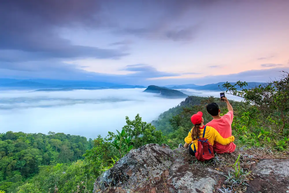 couple standing mountain min