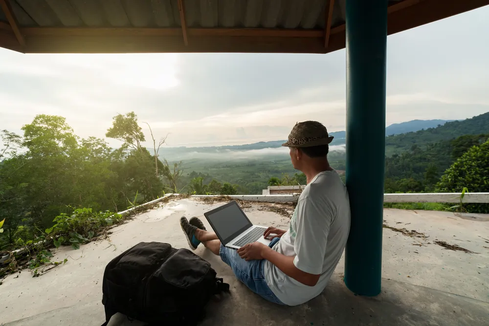 man using laptop while looking l